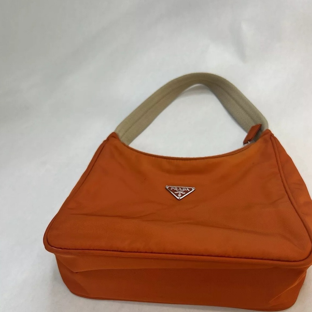 SOLD Fashion- Authentic PRADA mini shoulder bag . Includes authenticity card.